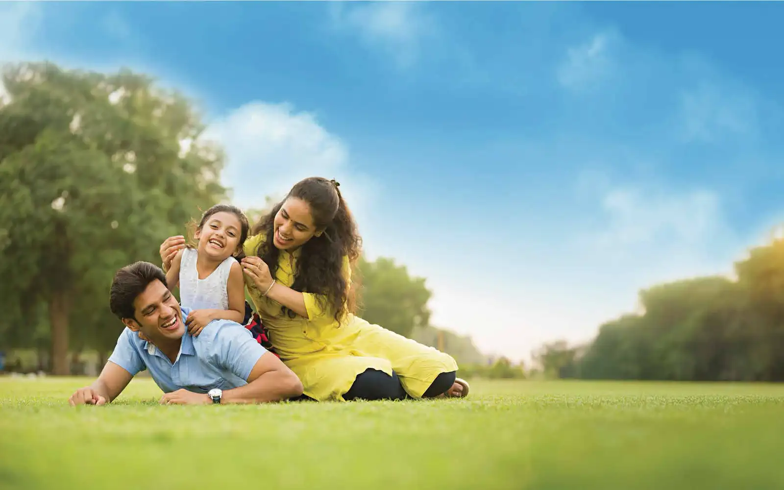 A family relaxing on the lawn at Godrej Verdania Estate, Indore