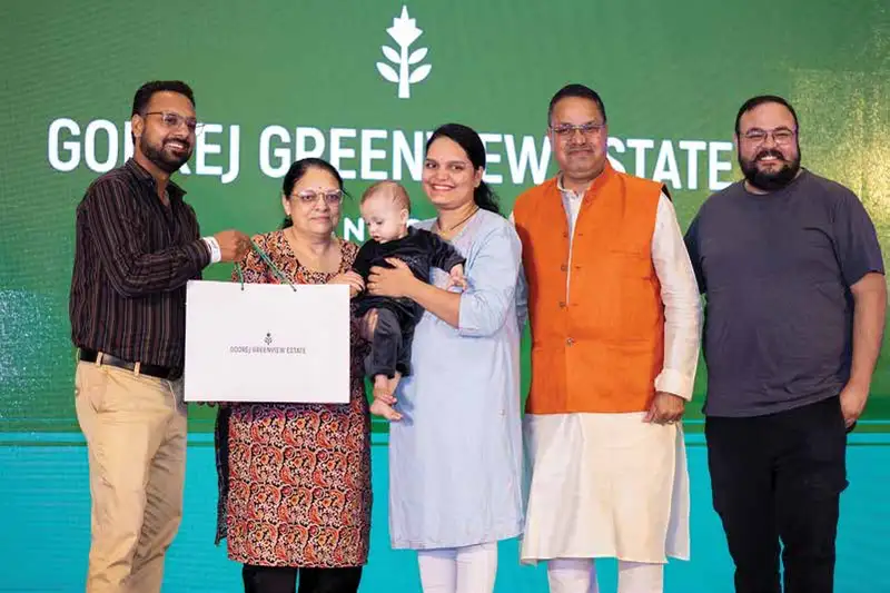Homebuyers receiving allotments on allotment day at Godrej Greenview Estate, Indore, the developer's previous plotted project in the city