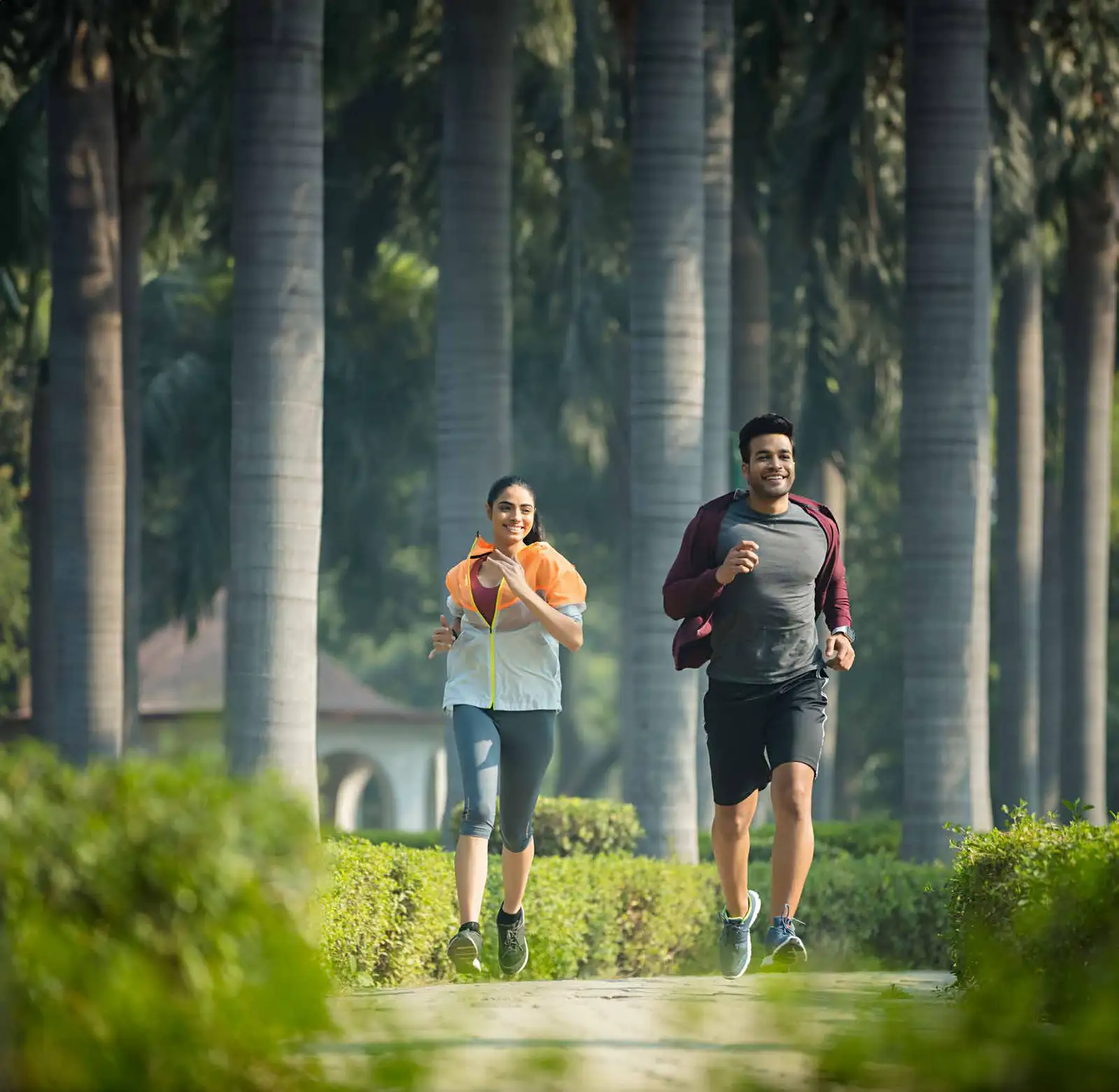 Residents jogging along the shaded colonnade at Godrej Verdania Estate, Indore