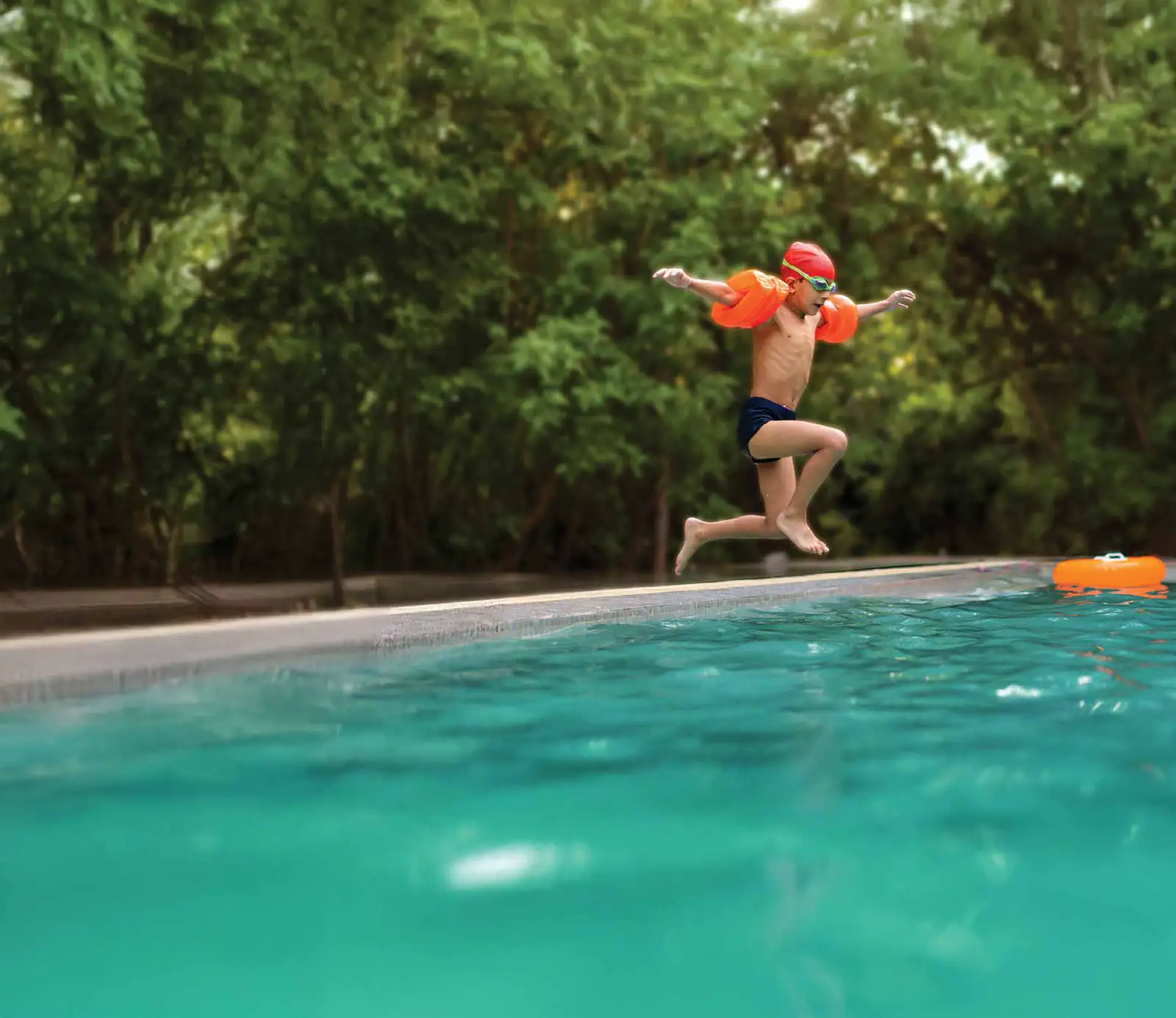 A child jumping into the kids' pool at Godrej Verdania Estate, Indore